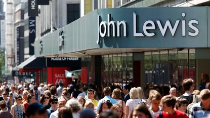 John Lewis home insurance ad— Shoppers walk past a John Lewis store on Oxford Street in London, U.K., on Tuesday, June 30, 2009. The number of Britons making shopping trips fell for a fifth consecutive month in June, deterred by warmer weather and the bleak economy. (Photo by Jason Alden/Bloomberg via Getty Images)