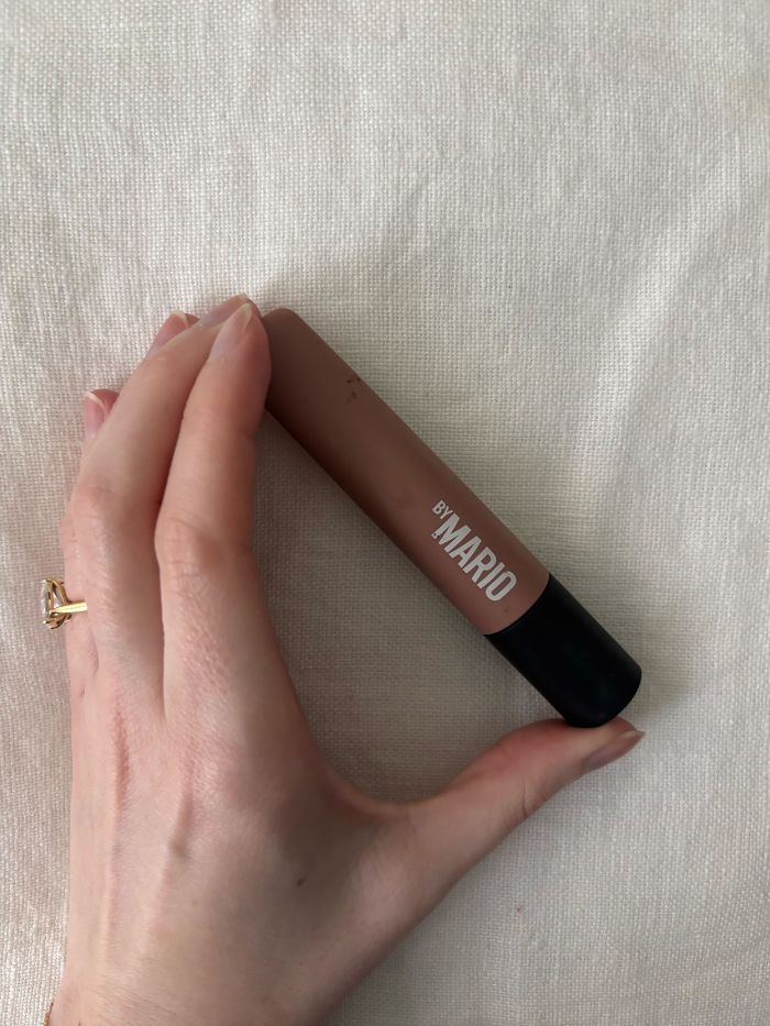 Deputy beauty editor Grace Lindsay holding the Makeup by Mario Master Mattes LW Cream Eyeshadow