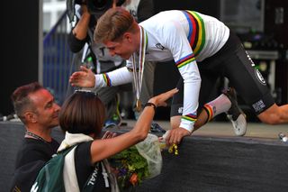 Belgium’s Remco Evenepoel embraces his parents after becoming junior road race world champion at the 2018 UCI Road World Championships in Innsbruck, Austria