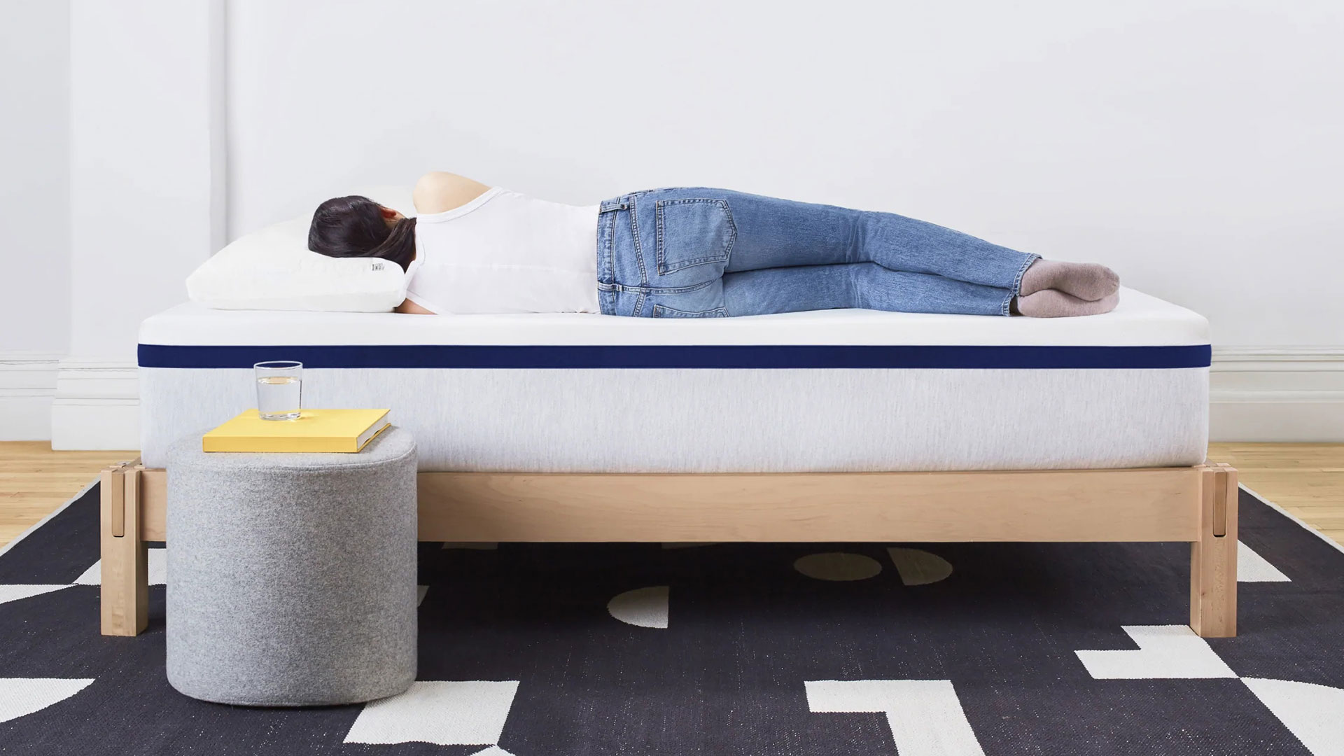 Woman lying on her side on a Helix Midnight mattress