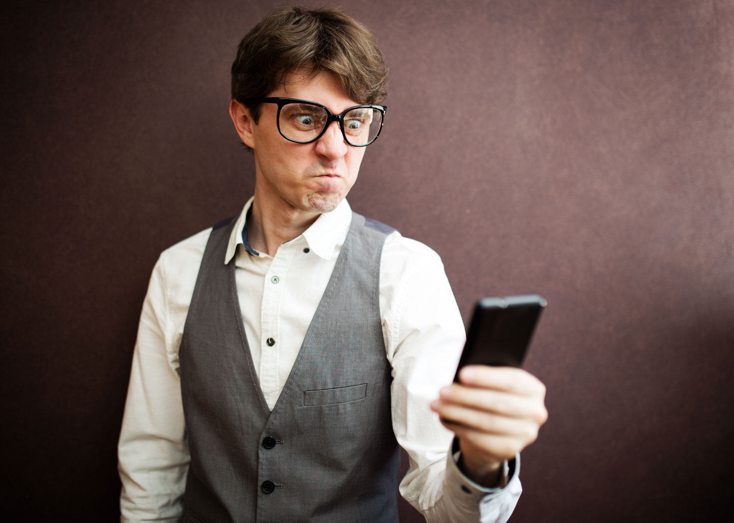 Angry dude stares at his phone