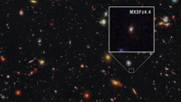 Lots of colorful blobs against the dark background of space. One of the blobs is highlighted and magnified in a boxout. This is the galaxy of note.