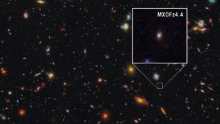 Lots of colorful blobs against the dark background of space. One of the blobs is highlighted and magnified in a boxout. This is the galaxy of note.