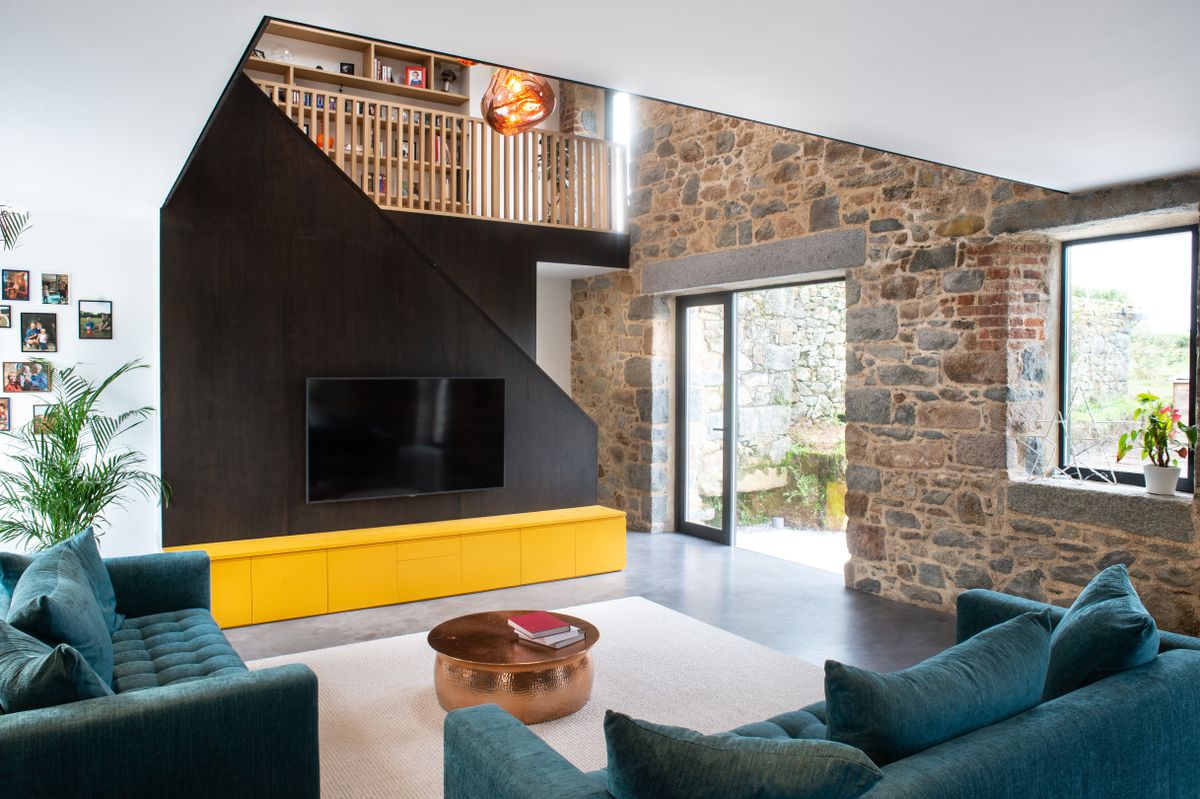 living room in barn conversion with tv unit