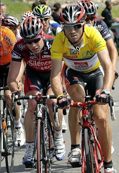 Cadel Evans looks a bit unhappy while riding in the peloton behind Valverde.