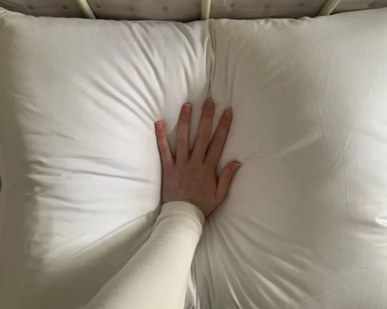 Demonstrating the loft of the Brooklinen Down Pillow