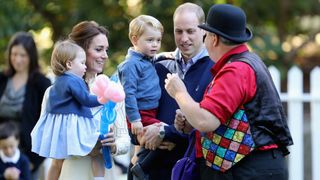 Prince William, Kate Middleton, Prince George and Princess Charlotte watch a magician