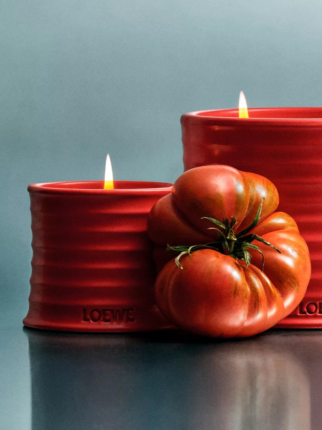 A red ceramic tomato leaves scented candle from Loewe