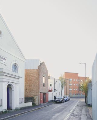 exterior view from the street of midcentury warehouse in south london transofrmation into lloyd eist house