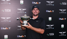 Chris Gotterup holds the Genesis Scottish Open trophy