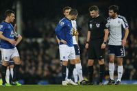 Kevin Mirallas of Everton holds on to the ball leaving Leighton Baines of Everton behind before taking the penalty kick that he missed in the first half (Photo by AMA/Corbis via Getty Images)