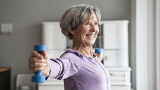 a senior woman doing exercise with weights