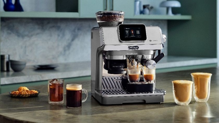 De’Longhi La Specialista Touch coffee machine with drinks on kitchen counter