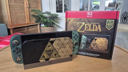 Legend of Zelda Nintendo Switch 2 special edition handheld in dock with packaging on a wooden table