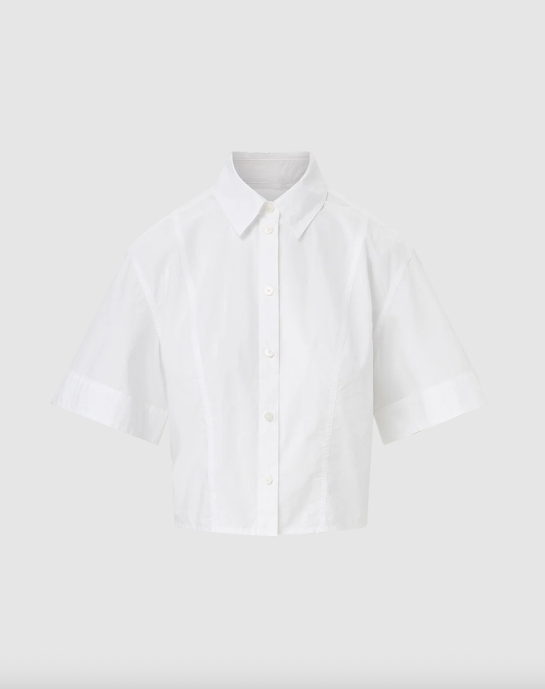 a button up shirt from veronica beard in front of a plain backdrop