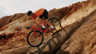 The Aurum Manto gravel bike being ridden is desert landscape