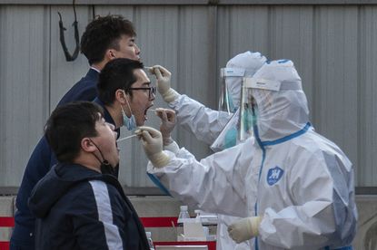Men in Beijing are tested for COVID-19 amid outbreak