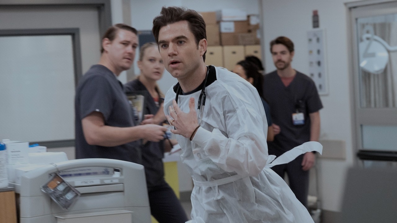 Langdon running through the ER with his left hand up, you can see a gold ring on his left hand. 