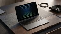 A sleek laptop rests on a wooden desk, its screen displaying a pattern of horizontal green and blue lines. Nearby, a coiled cable and a minimalist tray.
