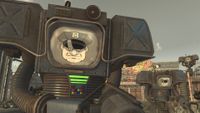 Two Fallout Securitrons standing before the entrance of the New Vegas Strip.