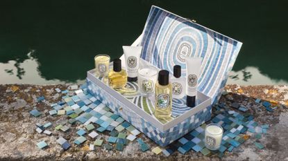 A summer advent calendar with three candles, a solid fragrance balm, fragrance oils and lotions from Diptyque