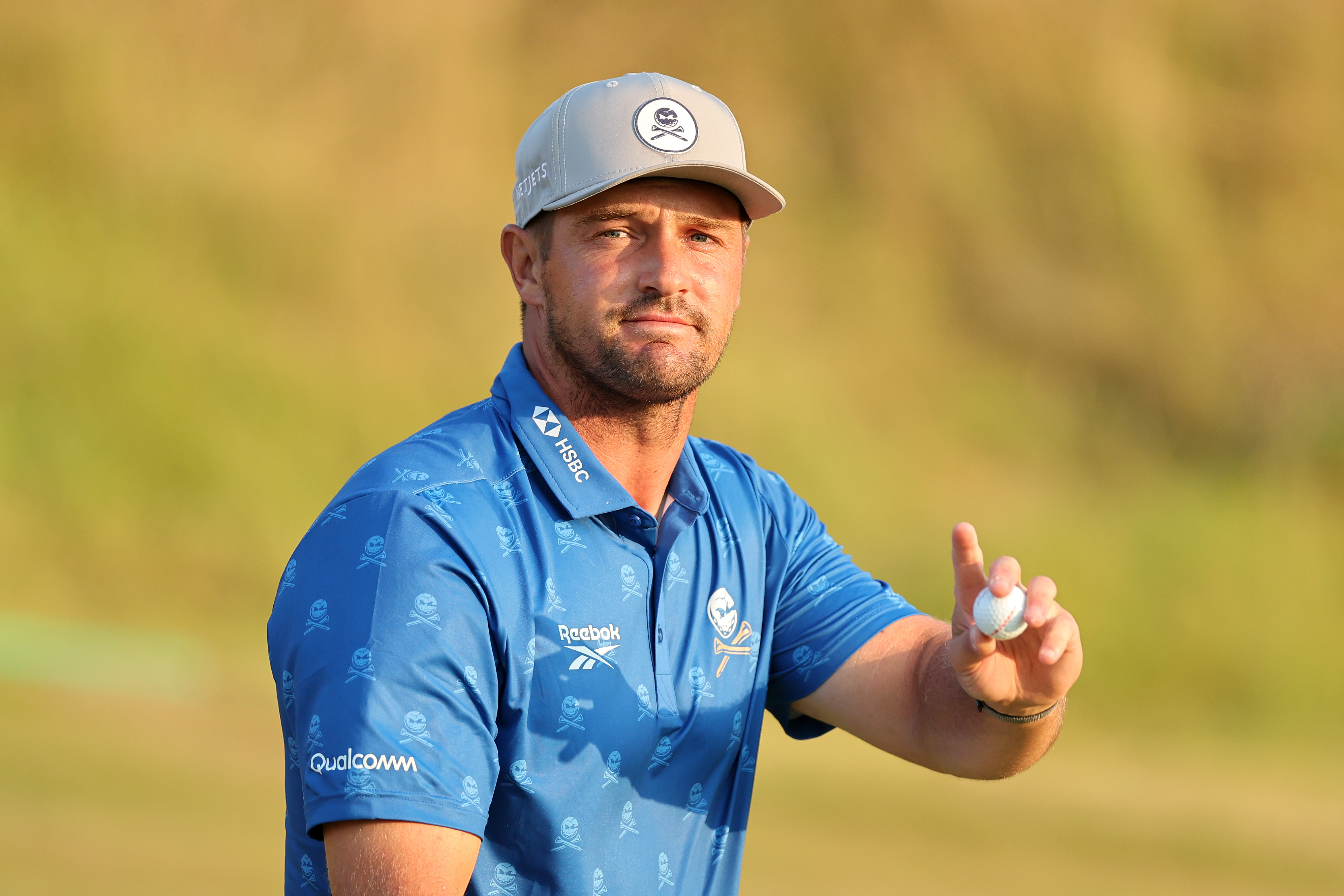 Bryson DeChambeau waves to the crowd during round two of The Open in 2026