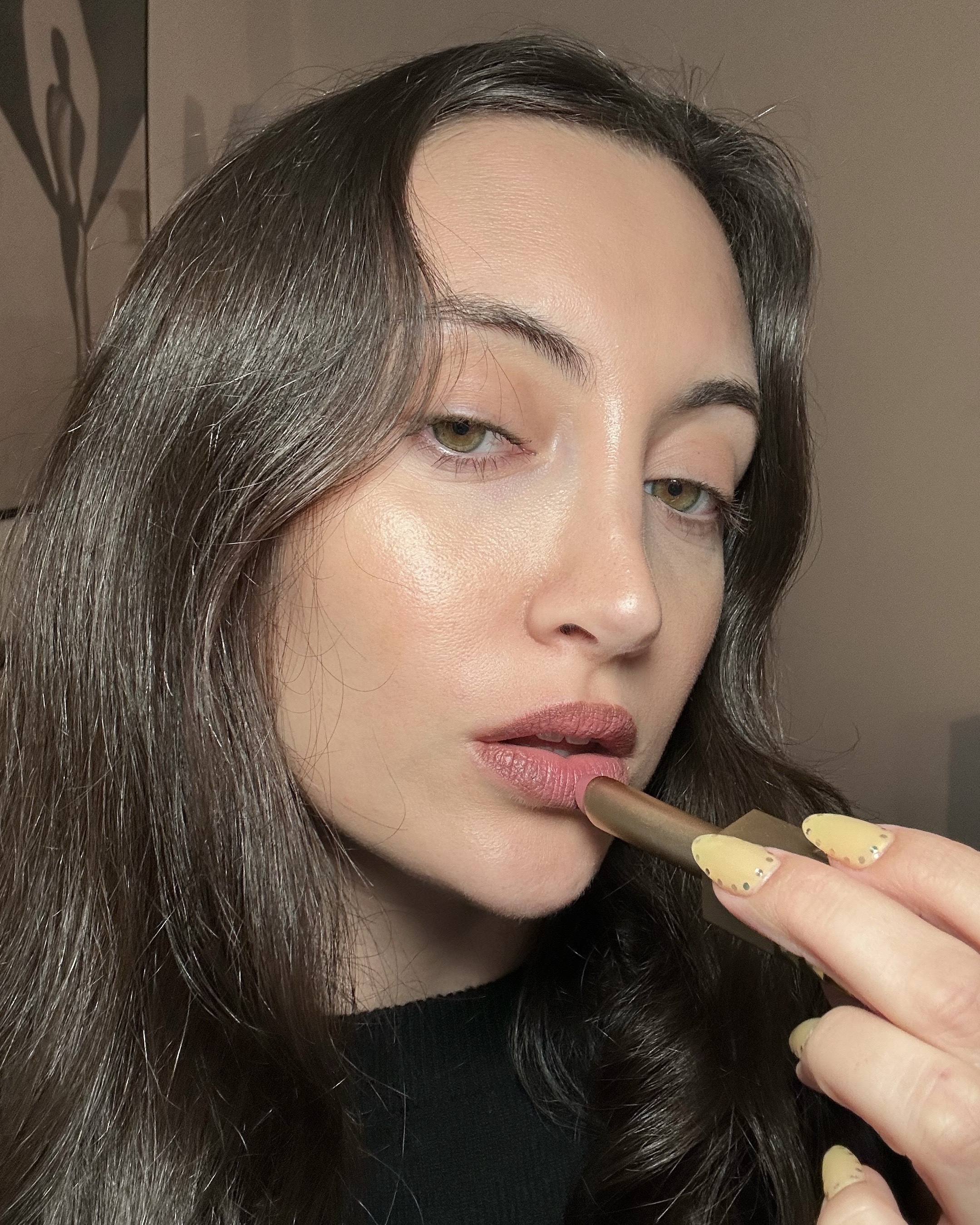 Associate beauty editor Alyssa Brascia applying and wearing the Valentino Spike Valentino Buttery Matte Lipstick.