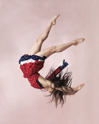 gymnast Suni Lee wearing a loveshackfancy red white and blue dress from her collaboration
