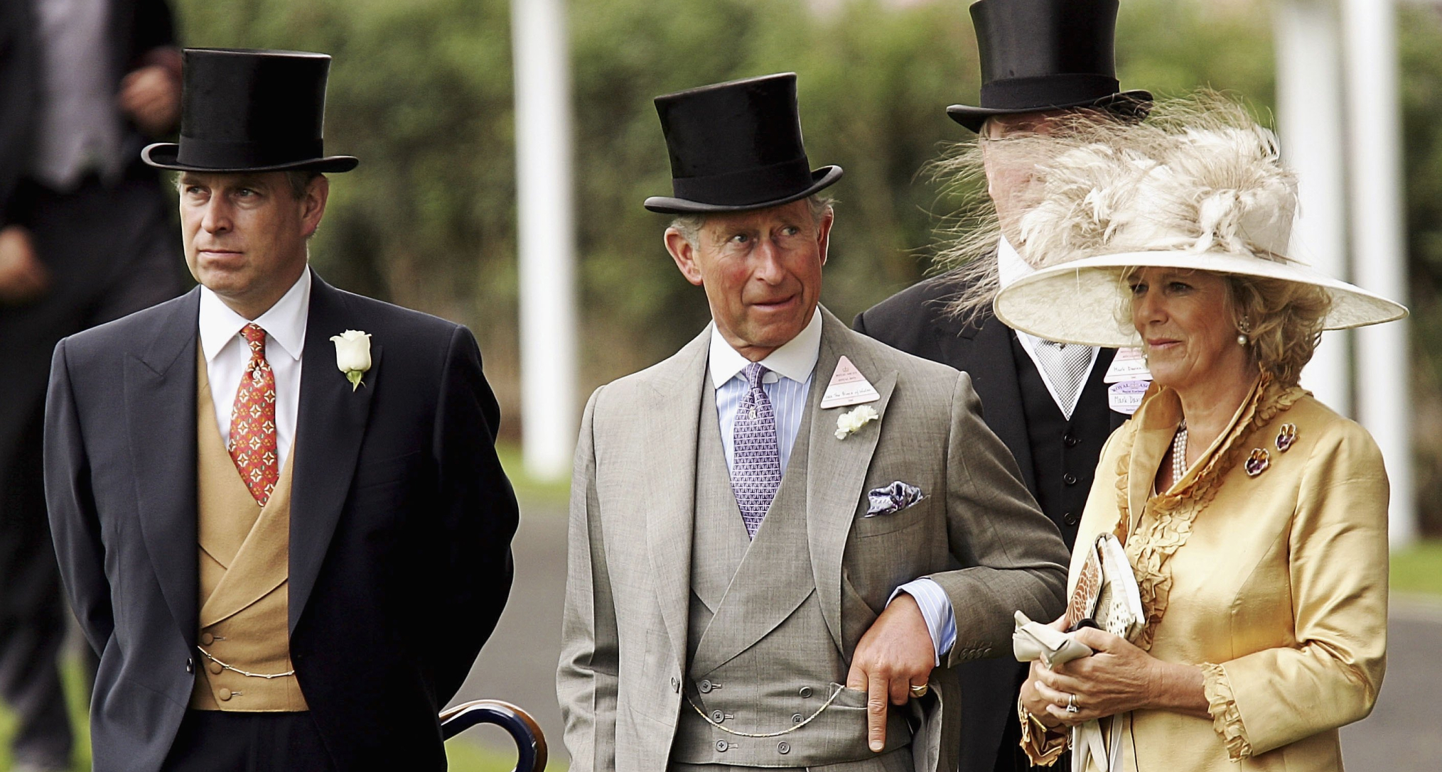 Prince Andrew, King Charles and Queen Camilla standing in a row at Royal Ascot