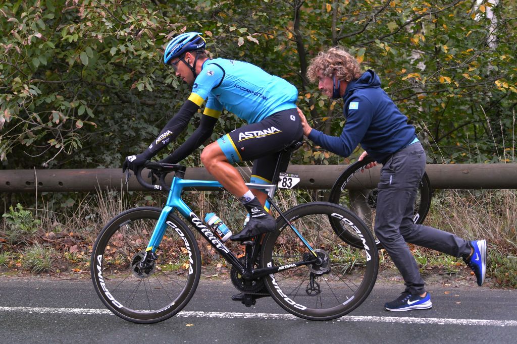 GERAARDSBERGEN BELGIUM OCTOBER 03 Daniil Fominykh of Kazahkstan and Astana Pro Team Mechanic Mechanical Problem Wheel during the 16th BinckBank Tour 2020 Stage 5 a 1836km stage from Ottignies Louvain la Neuve to Muur van Geraardsbergen 108m BinckBankTour BinckBankTour on October 03 2020 in Geraardsbergen Belgium Photo by Luc ClaessenGetty Images