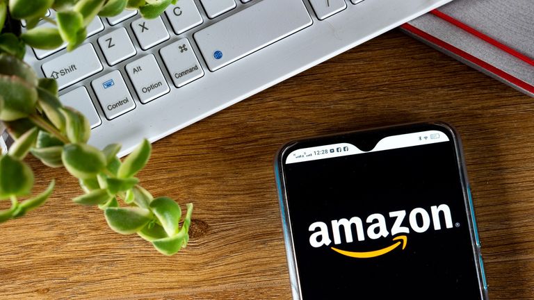 In this photo illustration an Amazon logo seen displayed on a smartphone