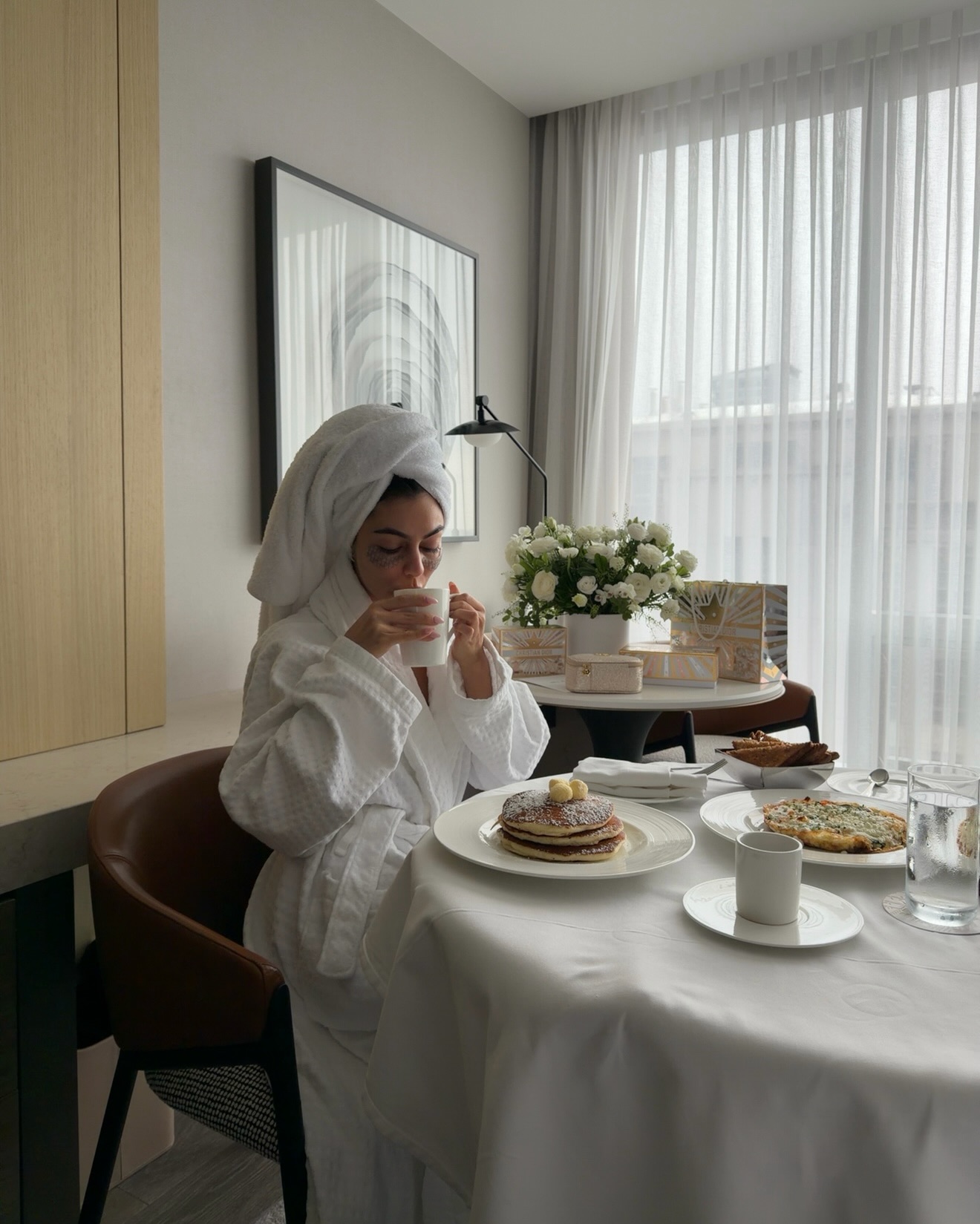 Mobina Peiman in a white bath robe
