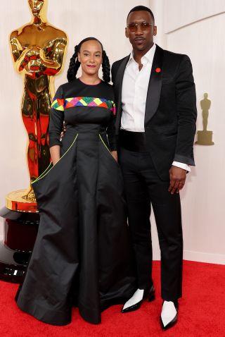 HOLLYWOOD, CALIFORNIA - MARCH 10: Amatus Sami-Karim and Mahershala Ali attend the 96th Annual Academy Awards on March 10, 2024 in Hollywood, California.