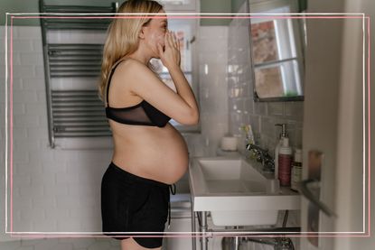 A pregnant woman washing her face