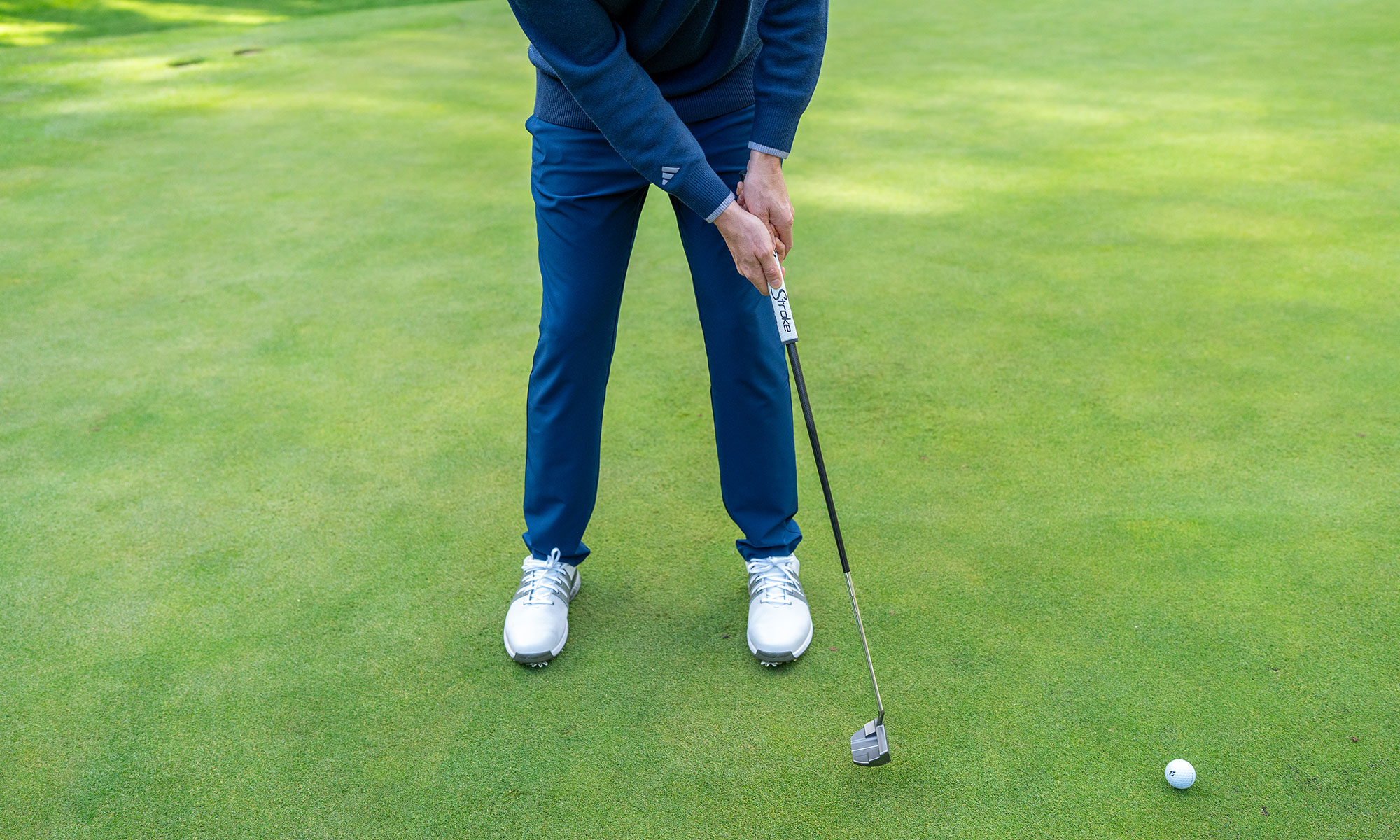 Ben Emerson in the follow through position with a putter