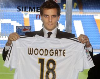 Jonathan Woodgate holds up his shirt after signing for Real Madrid, 2004