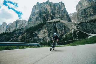 Safa Brian descends a road in the Dolomites