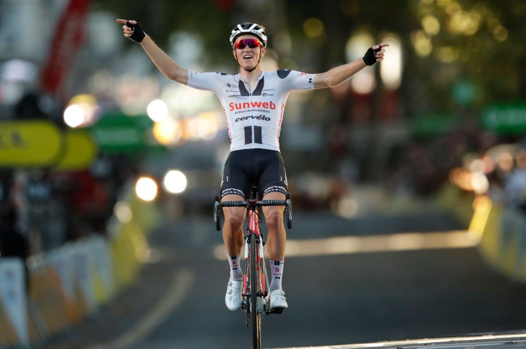 Stage winner Team Sunweb rider Denmarks Soren Kragh Andersen celebrates as he crosses the finish line at the end of the 14th stage of the 107th edition of the Tour de France cycling race 197 km between ClermontFerrand and Lyon on September 12 2020 Photo by STEPHANE MAHE POOL AFP Photo by STEPHANE MAHEPOOLAFP via Getty Images