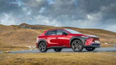 Toyota bz4X in rugged terrain with moody sky