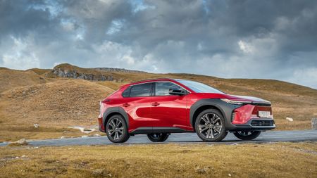 Toyota bz4X in rugged terrain with moody sky