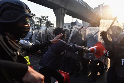 Protesters clash with police in Bangkok