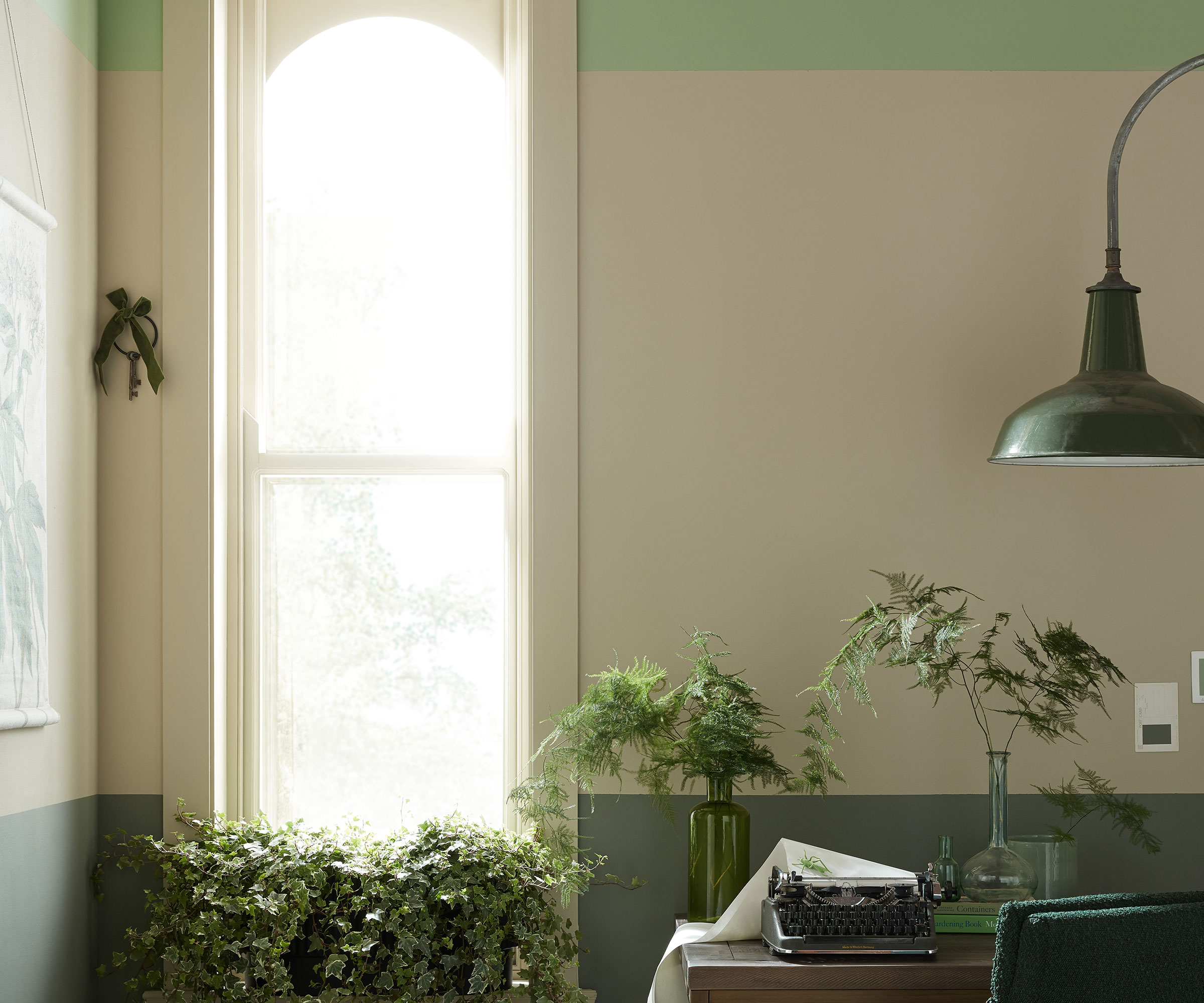 two tone green home office with houseplants
