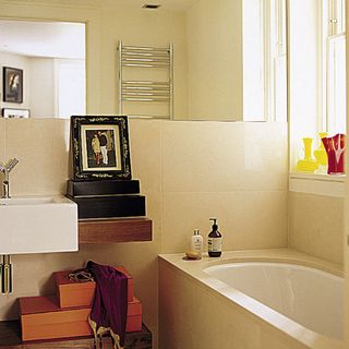 bathroom with cream wall and bathtub