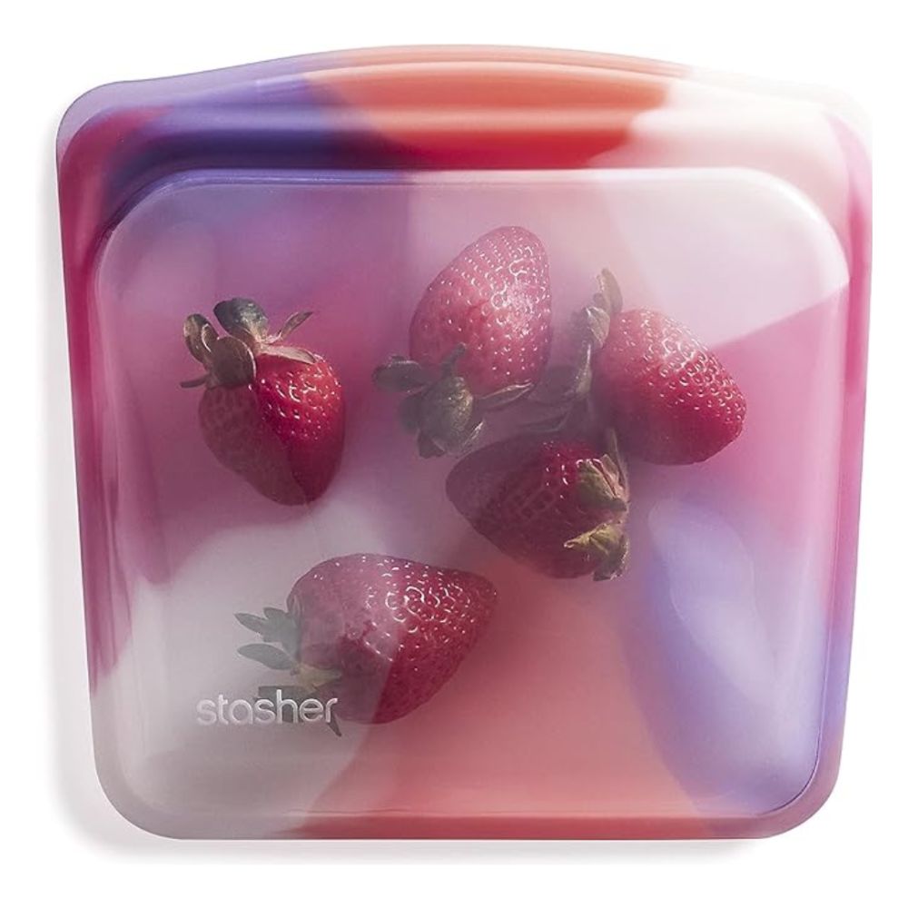 pink and purple silicone food storage bag with strawberries in