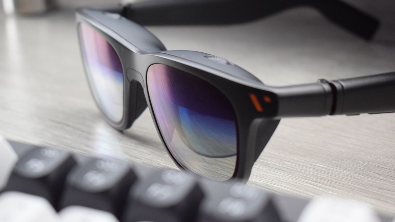 Photo of VITURE Pro XR Glasses Chromatic lenses with Keychron Q1 HE keyboard in foreground.