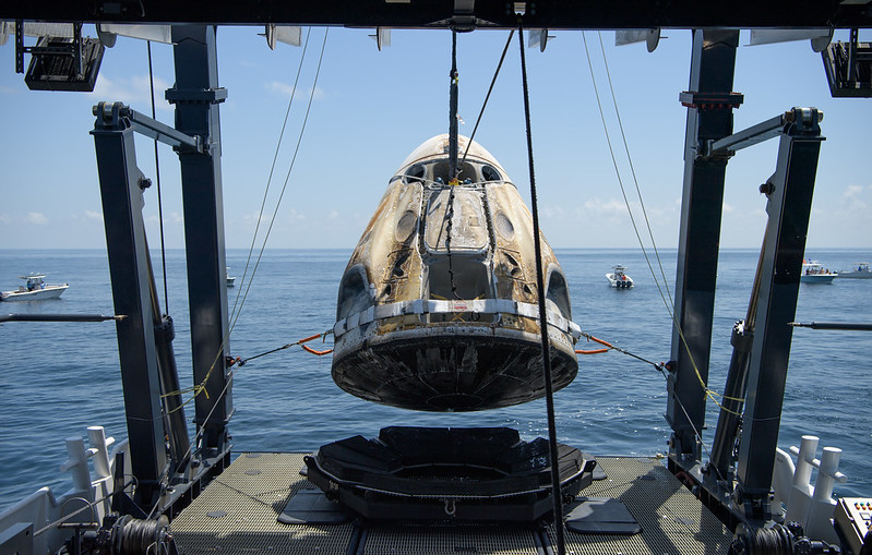 A recovery ship pulls the Crew Dragon capsule carrying NASA astronauts Bob Behnken and Doug Hurley out of the Gulf of Mexico on Aug. 2, 2020.