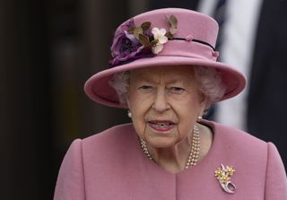 Queen Elizabeth II attends the opening ceremony of the sixth session of the Senedd at The Senedd on October 14, 2021 in Cardiff, Wales