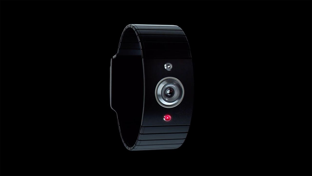 The HndsUp civilian camera featuring a circular lens and a red indicator light, set against a black background