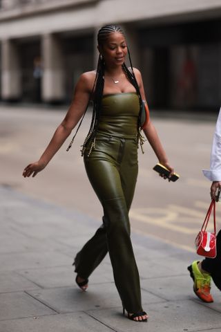 woman wearing leather tube top and leather pants