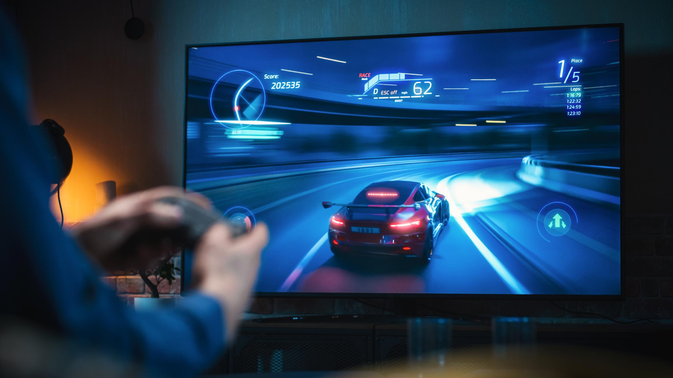  a gaming monitor with someone playing a racing game 